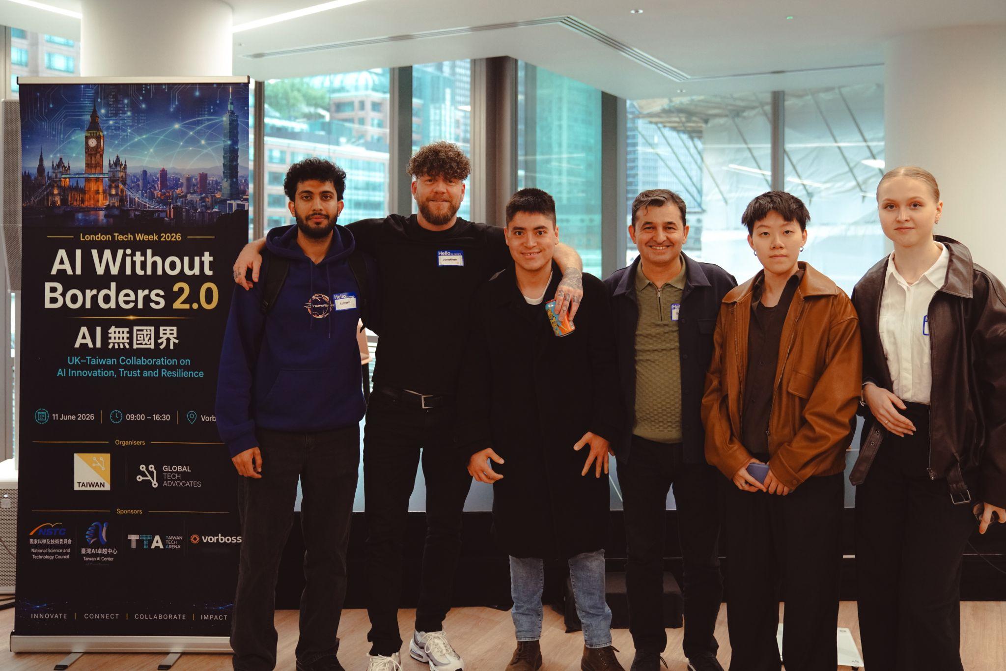 A Build Lab team together in front of the AI Without Borders 2.0 banner