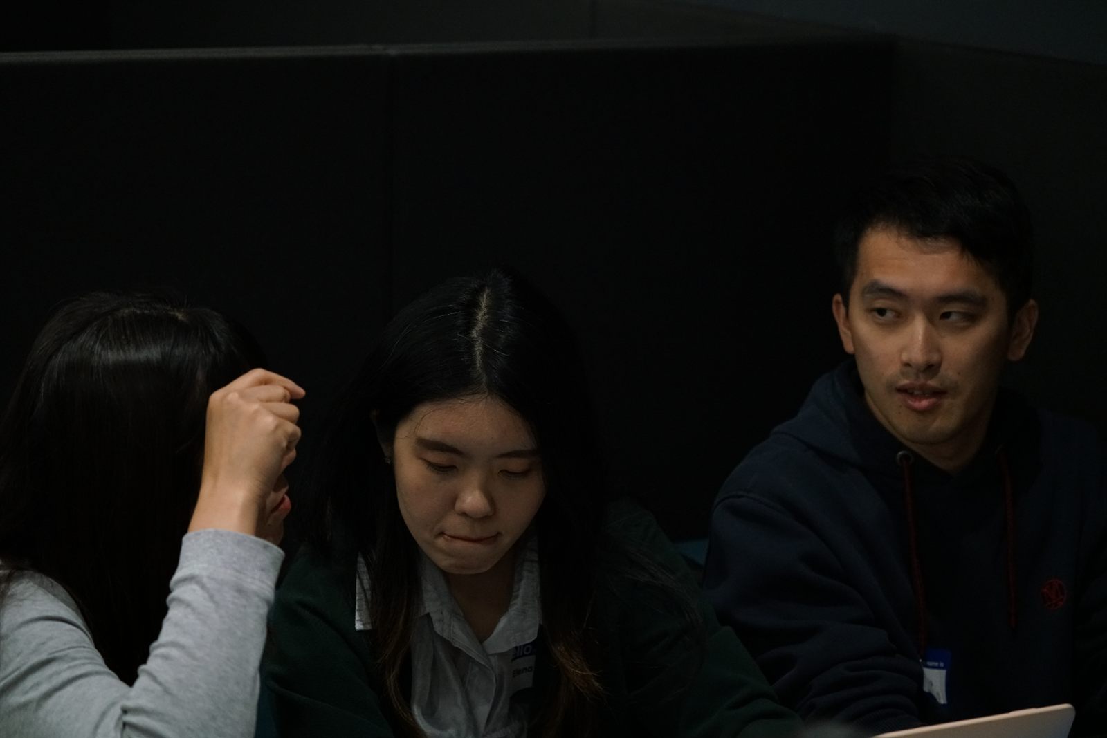 Team members working at their laptops during the build