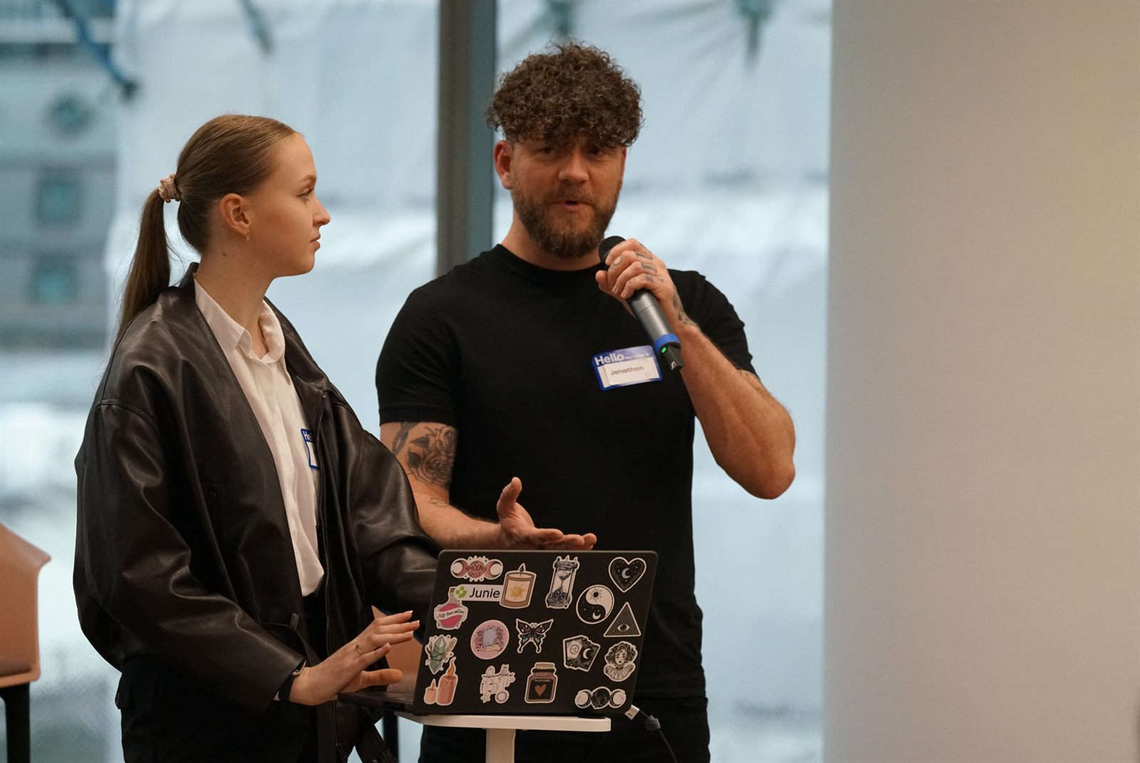 Two teammates presenting their prototype to the room
