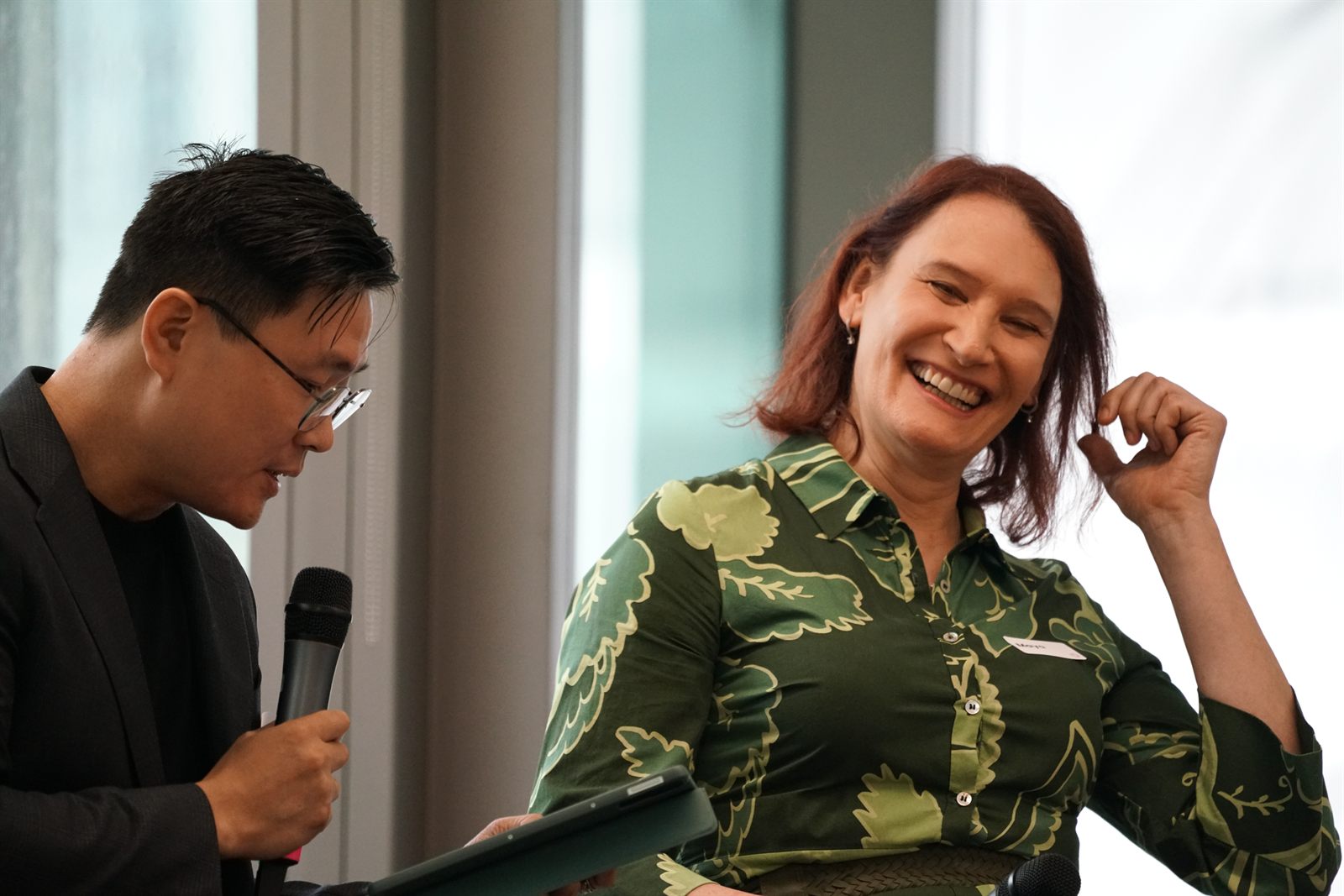 Moderator YJ Chen and panellist Maya Carlyle sharing a light moment during Panel 1