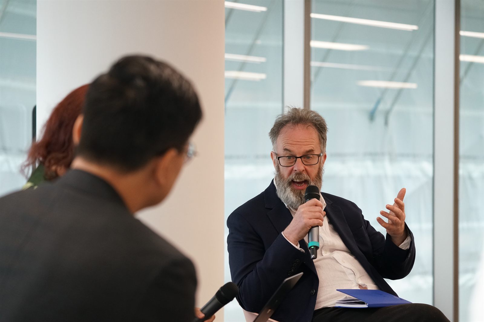 John Spindler responding to moderator YJ Chen during Panel 1