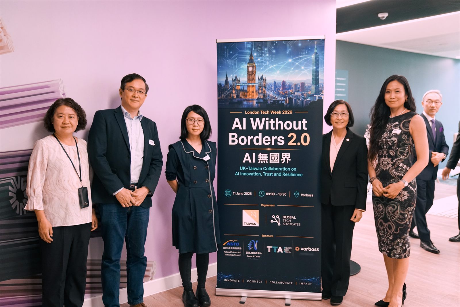 Panel 2 speakers and guests together beside the AI Without Borders 2.0 banner