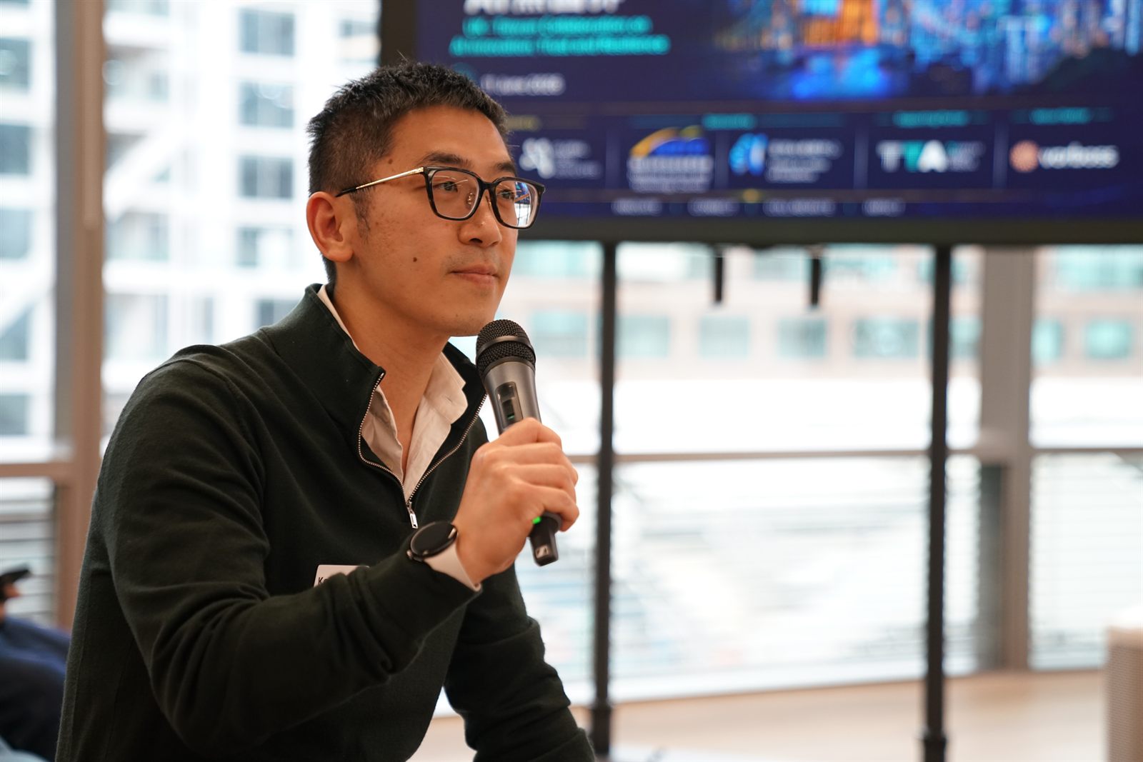 A presenter taking questions during the startup showcase