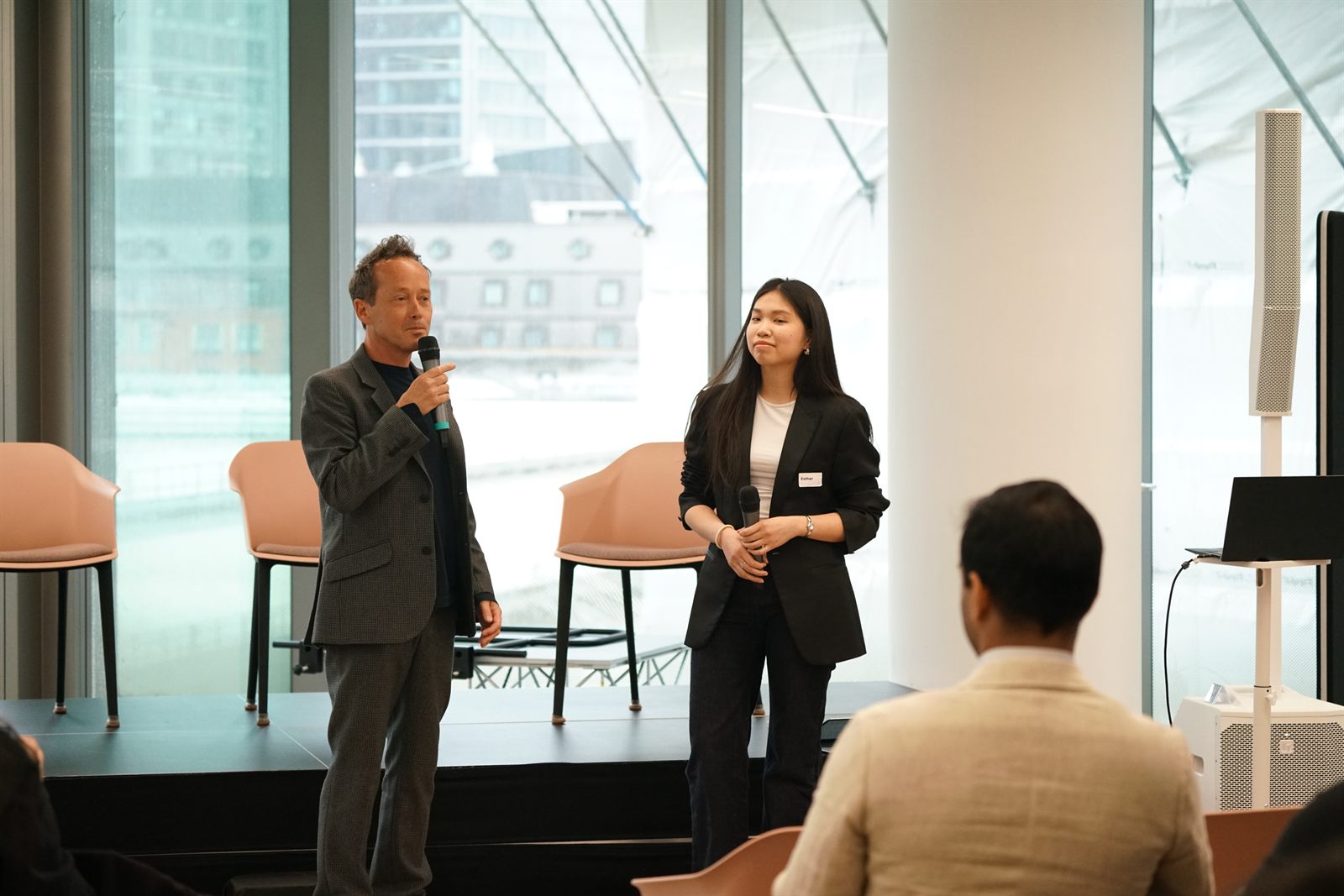 Founders presenting on stage during the startup showcase